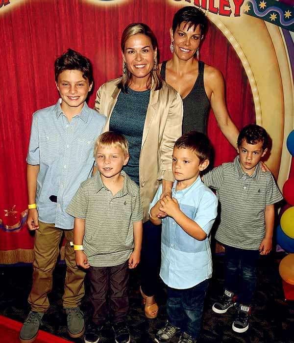 Image of Caption: Cat Cora with her former wife Jenifer along with their four sons Zoran, Caje, Thatcher, and Nash.