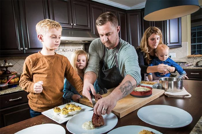 Image of renowned chef, Bryan Voltaggio with his family