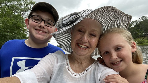 Brenda Gantt with her grandchildren taking selfie together 