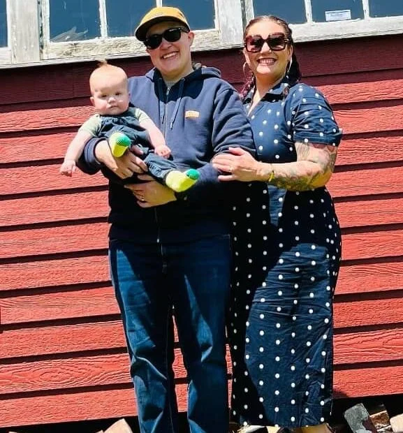 Image of Karen Akunowicz and LJ Johnson with their baby